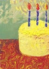 Card with a yellow cake with candles on a patterned tablecloth