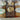 Three loaves of bread in clear plastic packaging with Misericordia labels on a gray background.