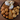 Assorted pastries including muffins, and bread on a wooden surface
