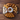 Assorted pastries on a round platter on a wooden surface