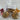 Three packaged cookies with ribbons and personalized tags on a marble surface
