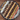 Assorted desserts arranged in a circular pattern on a wooden surface.