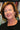 Woman in front of a bookshelf