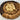 Assorted cookies arranged in a circular pattern on a white plate.