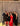 Group of people posing for a photo in front of a gray curtain