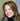 Woman wearing a black jacket indoors