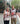 Two people standing on the sidewalk and wearing matching Misericordia Candy Days aprons to collect donations 